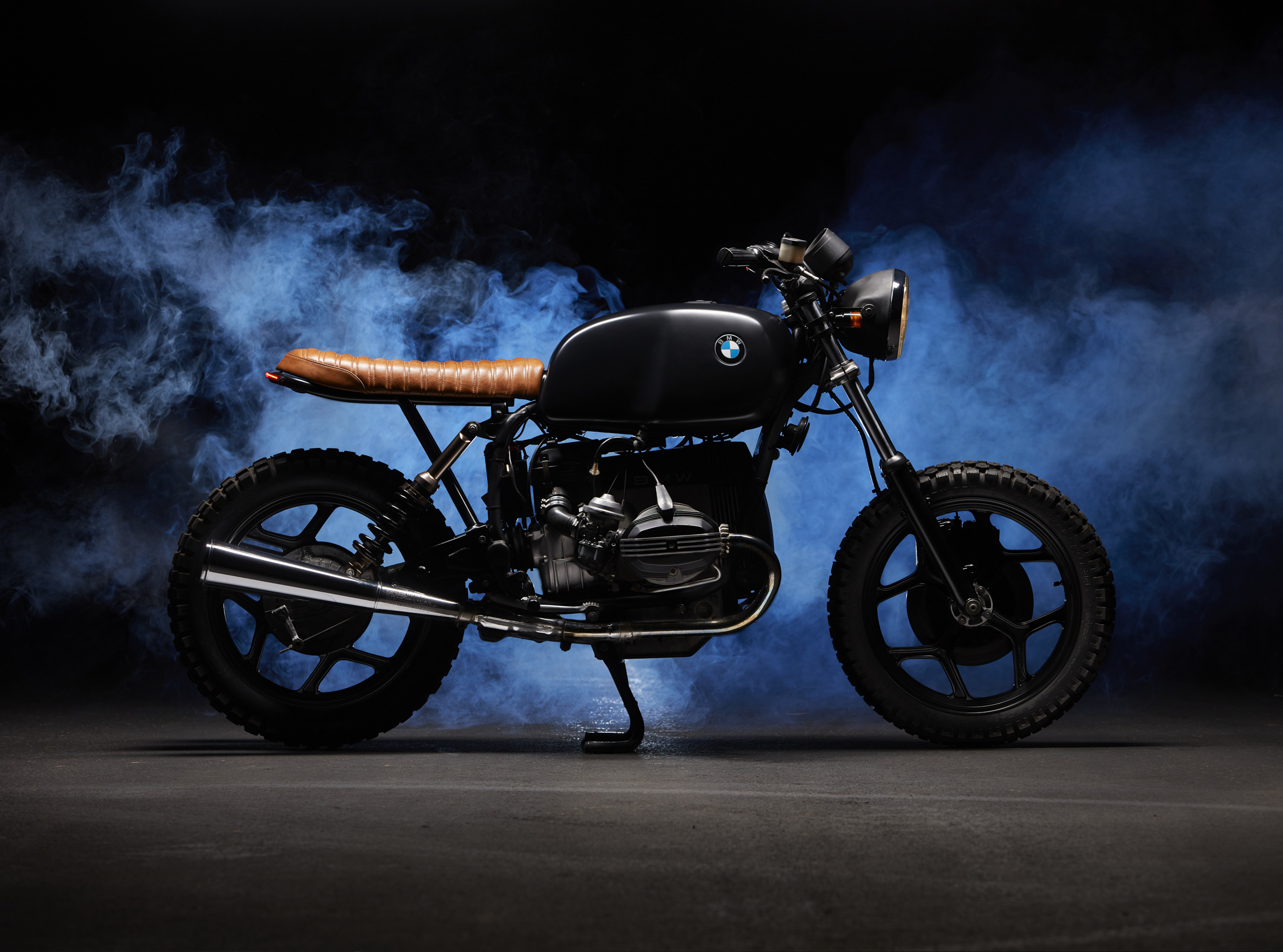 BMW Cafe Racer Scrambler motorcycle studio photograph with blue smoke