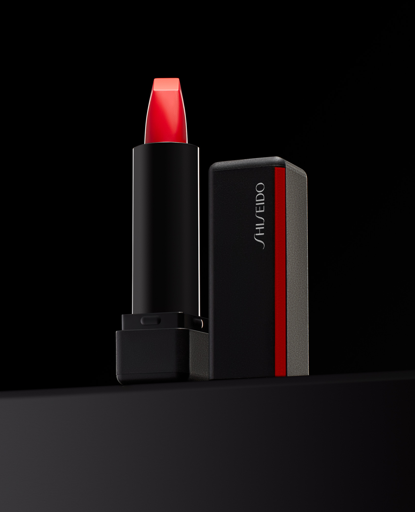 Shiseido Cosmetics Lipstick Product Photo on black pedestal